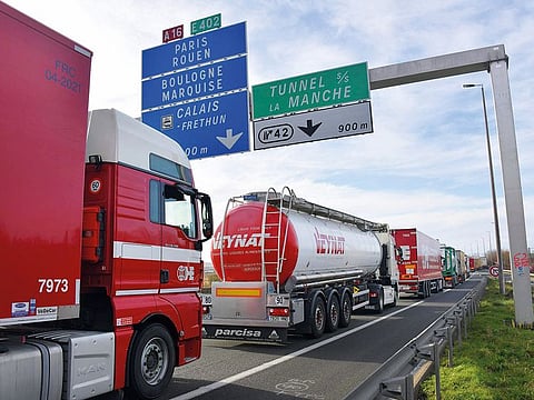 Trucks on the A16 highway between Dunkirk and Calais in France. Economists say there's a 65% chance of a US recession and a 49% chance of a European one within the next year.