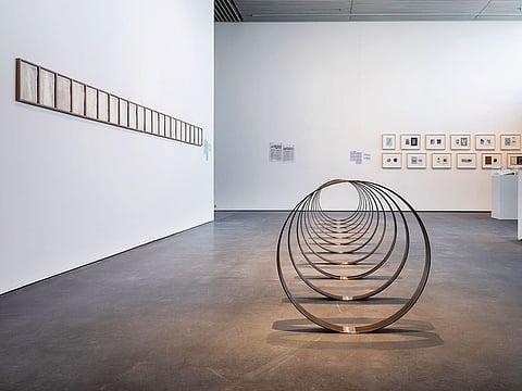 Installation view of Crude, curated by Murtaza Vali, at Jameel Arts Centre, Dubai; in the foreground, Rayyane Tabet’s installation, Steel Rings