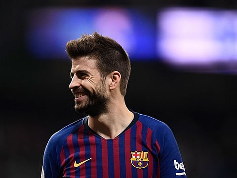 Barcelona's Spanish defender Gerard Pique smiles during the Spanish Copa del Rey (King's Cup) semi-final second leg football match between Real Madrid and Barcelona at the Santiago Bernabeu stadium in Madrid.