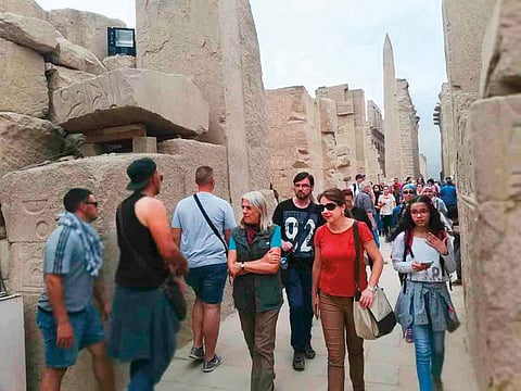 Tourists tour the famed Karnak temple complex in Luxor.