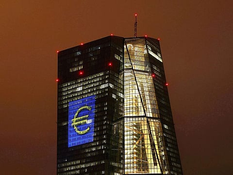 The headquarters of the European Central Bank (ECB) are illuminated with a giant euro sign at the start of the "Luminale, light and building" event in Frankfurt, Germany, March 12, 2016