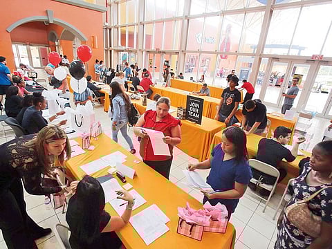 People attend a job fair in Miami. With the world’s biggest economy – United States – having shed 6.5 million jobs last week, up from 3.5 million the week before, economists are now being led to believe that the economy was in far worse shape than initially thought.