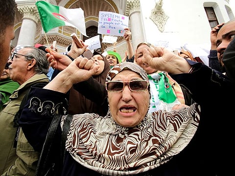 A woman gestures during a protest against President Abdul Aziz Bouteflika in Algiers.