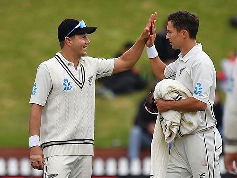 New Zealand's Neil Wagner (L) celebrates Bangladesh's Abu Jayed being bowled by teammate Trent Boult (R) during day three of the second Test cricket match between New Zealand and Bangladesh at the Basin Reserve in Wellington on March 10, 2019.
