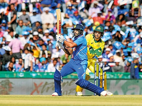 India’s Shikhar Dhawan hits a six during the fourth ODI match against Australia in Mohali on Sunday.