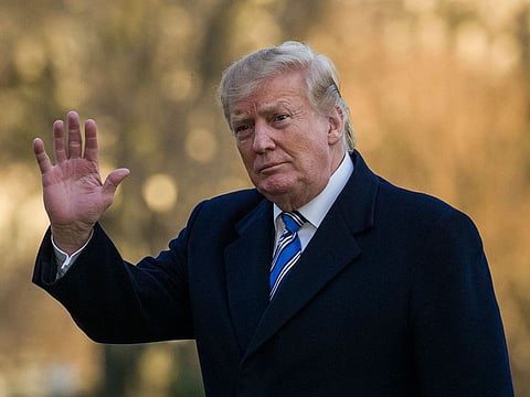 President Donald Trump waves as he walks on the South Lawn after stepping off Marine One at the White House, Sunday, March 10, 2019, in Washington. 
