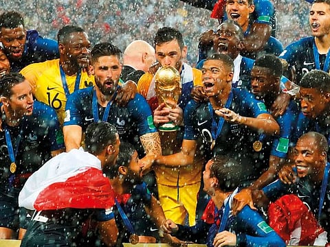 France’s Hugo Lloris kisses the trophy as they celebrate after winning the World Cup. Reuters