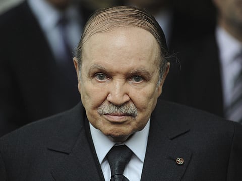 In this Nov. 21 2011 file photo, Algerian President Abdelaziz Bouteflika waits for Rachid Ghannouchi, head of the Tunisian party Ennahdha, in Algiers. 
