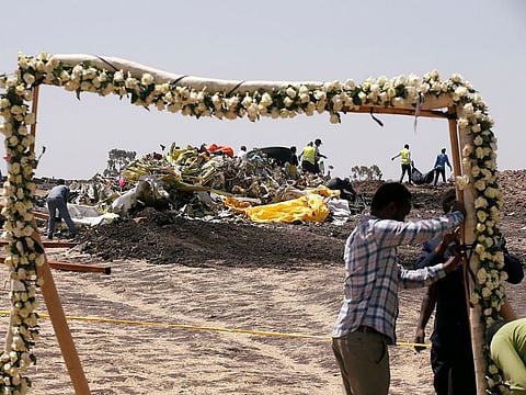 Ethiopians prepare a commemoration ceremony at the scene of the Ethiopian Airlines Flight ET 302 plane crash, near the town of Bishoftu, southeast of Addis Ababa, Ethiopia March 13, 2019.