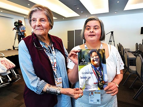 Dina Galal, with her book (right) and her mother Fatma Sakr at the World special Games 2019.