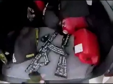 A still image taken from video circulated on social media, apparently taken by a gunman and posted online live as the attack unfolded, shows him retrieving weapons from the boot of his car in Christchurch, New Zealand.