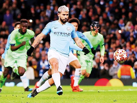 Manchester City's Sergio Aguero scores their first goal from a penalty.