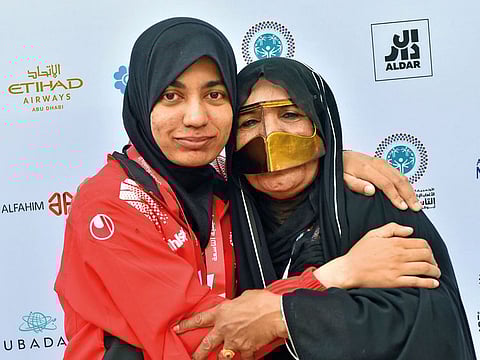 The gold medalist Hamda Al Hosani pof UAE (left) being congrats by her mother Zafrana  Hosani after the 100mtr running competition of the Mena special olympics at New York University in Abu Dhabi