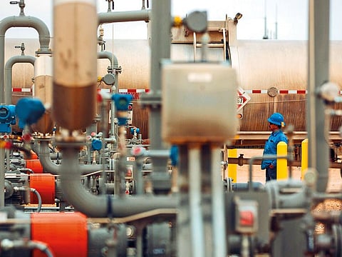 A worker unloads crude oil from a tanker in Loving County, Texas. US president Donald Trump would like to see oil trend around $60 per barrel.