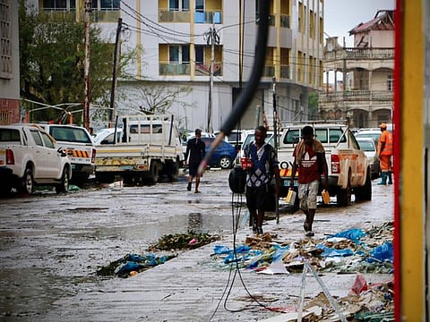Damages are seen in a street of Beira, Mozambique, on March 17, 2019, in the aftermath of the passage of the cyclone Idai.