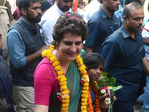 Indian political leader Priyanka Gandhi Vadra (C), Congress' general secretary for eastern Uttar Pradesh, meets supporter in Sirsa on March 18, 2019, during her boat trip from Allahabad to Varanasi along the Ganges river as part of her election campaign.