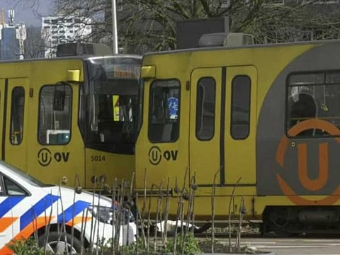 In this image taken from video, a body lays next to a tram as emergency services attend the scene of a shooting in Utrecht, Netherlands, Monday March 18, 2019. Police in the central Dutch city of Utrecht say on Twitter that "multiple" people have been injured as a result of a shooting in a tram in a residential neighborhood. 
