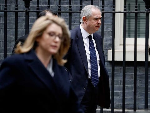 Britain's International Development Secretary and Minister for Women and Equalities Penny Mordaunt (L) passes Britain's Attorney General Geoffrey Cox as she arrives at 10 Downing Street in London.