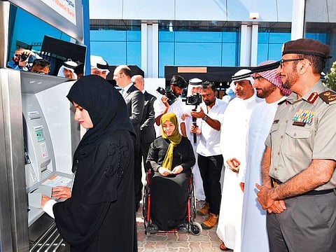 ATM for special needs at GDRFA Dubai in Al Jafliya . The ATM can be operated through voice-commands.