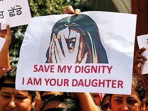 In this 2018 photo, people participate in a protest against the rape of an eight-year-old girl in Kathua near Jammu, and a teenager in Unnao, Uttar Pradesh state, in Amritsar, India.