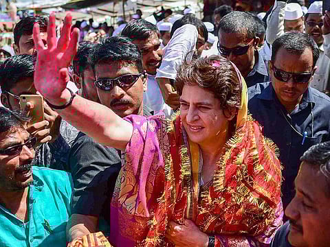 Congress General Secretary UP-East Priyanka Gandhi Vadra waves as she arrives at Dashashwamedh Ghat, in Varanasi, Wednesday, March 20, 2019.
