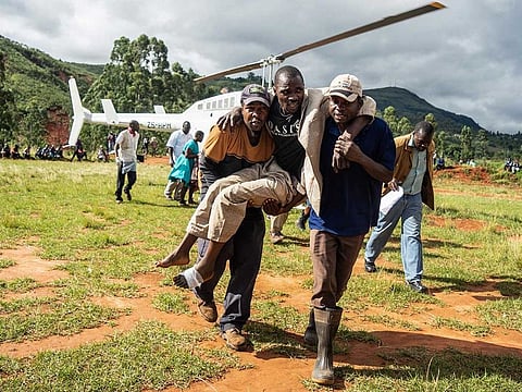A wounded survivor is evacuated by helicopter from Chimanimani on March 19, 2019 to an hospital in Mutare, after the area was hit by the Cyclone Idai.