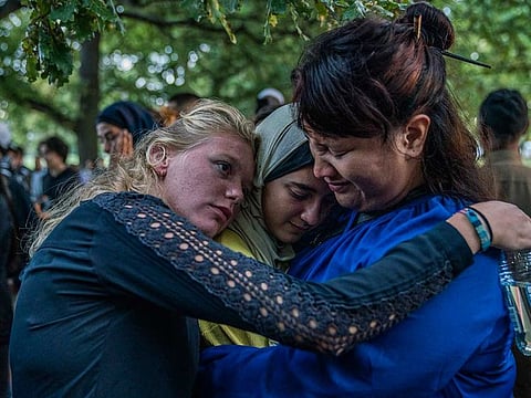 People gather at a community-led vigil in tribute to victims near Al Noor Mosque in Christchurch, New Zealand, March 20, 2019.