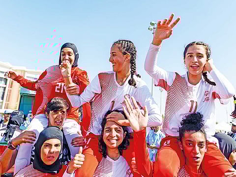 UAE women's team celebrate their gold medal winning performance.