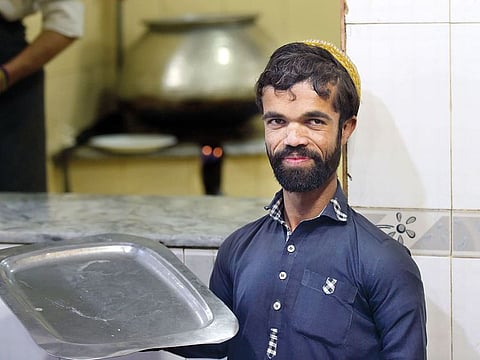 Rozi Khan, a 25-year-old waiter who resembles US actor Peter Dinklage, at Dilbar Hotel in Rawalpindi. Khan had never heard of Game of Thrones — or the character Tyrion Lannister.
