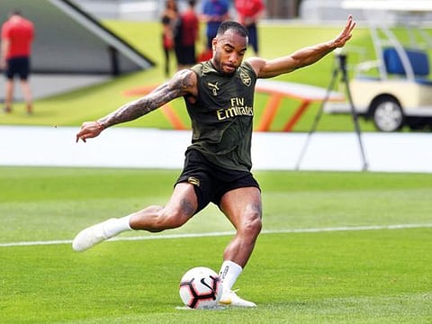 Arsenal coach Unai Emery (left) put his boys through warm-weather training in Dubai yesterday after the team landed late on Thursday.