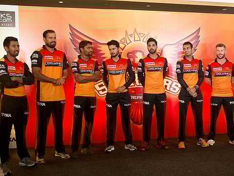 Sunrisers Hyderabad cricket team members (from left): Wriddhiman Saha, Yusuf Pathan, Sandeep Sharma, Manish Pandey, Bhuvneshwar Kumar, Siddhart Kaul, David Warner stand for photographs during a press conference in Hyderabad.  