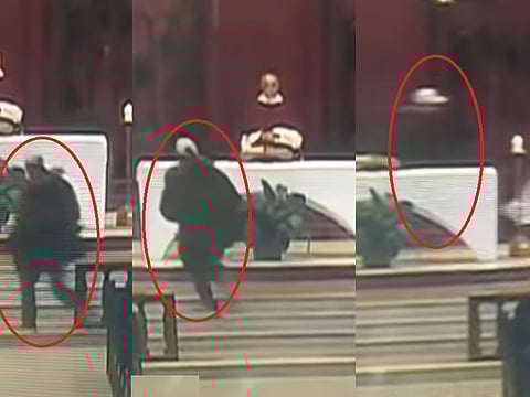 The attacker appears to strike the priest twice, knocking him down.