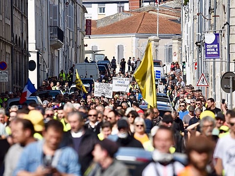 Yellow Vest protesters take part in an anti-government demonstration called by the 'Yellow Vest' (gilets jaunes) movement in La Rochelle, southwestern France on March 23, 2019.
