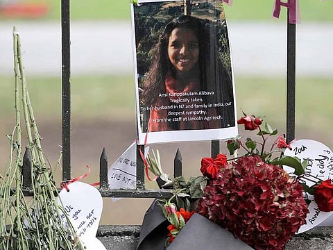 A tribute of a victim of mosque shooting, Ancia Alibava, hangs on a wall at the Botanical Gardens in Christchurch, New Zealand, Thursday, March 21, 2019.