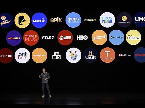 File picture of Peter Stern, vice-president of services at Apple Inc., against an app backdrop.