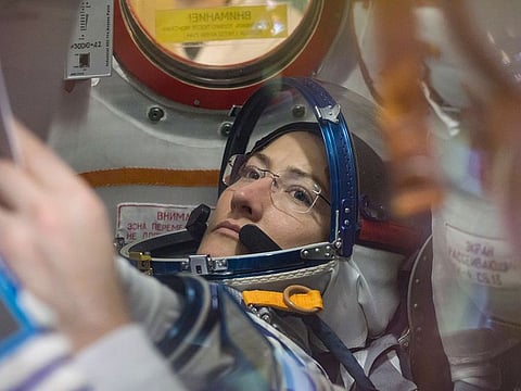 A photo provided by NASA of Christina Koch working inside the Soyuz MS-12 spacecraft at the Baikonur Cosmodrome in Kazakhstan.