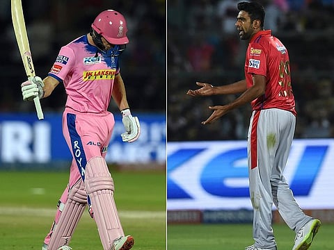 Rajasthan Royals' Jos Buttler walking back to the pavilion after he was dismissed by Kings XI Punjab's Ravichandran Ashwin (right) during the IPL Twenty20 match at the Sawai Mansingh Stadium in Jaipur on March 25. 