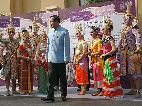 Thai Prime Minister Prayuth Chan-ocha, center, talks to performers in classic Ramayana, during an event to promote Thai Heritage Conservation Day before cabinet meeting at the government house in Bangkok, Thailand, Tuesday, March 26, 2019. 