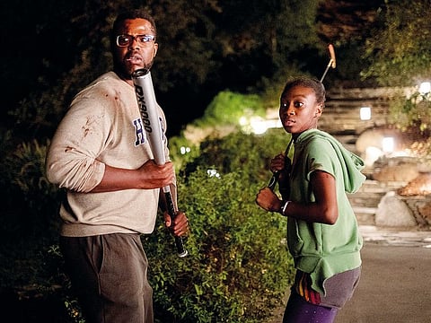 Gabe Wilson (Winston Duke) and Zora Wilson (Shahadi Wright Joseph) in ‘Us’. (Below) The Tethered ones