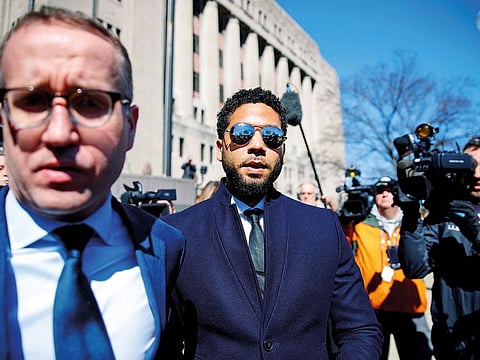 Jussie Smollett leaves court after charges against him were dropped on Tuesday.