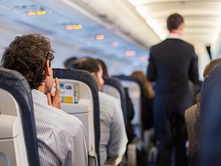 Passengers duct-tape unruly traveller who allegedly tried to open a door during flight