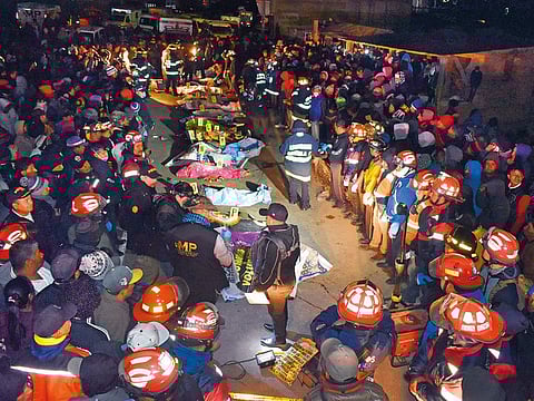 covered bodies of some eighteen victims killed after a truck ran them over in Nahuala municipality in Solola Departament, about 160kms west of Guatemala City on March 28, 2019.