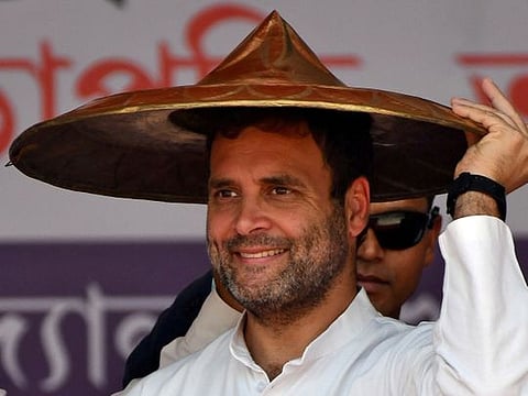 Rahul Gandhi, President of India's main opposition Congress party, wears a "Japi" (a traditional hat of Assam) presented to him by party members during a rally in Guwahati, India, February 26, 2019. 