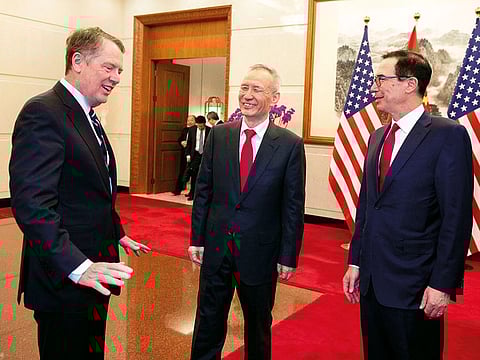 China's Vice Premier Liu He (C) talks with US Treasury Secretary Steven Mnuchin (R) and US Trade Representative Robert Lighthizer (L) at Diaoyutai State Guesthouse in Beijing on March 29, 2019.