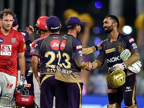 Kolkata Knight Riders (KKR) captain Dinesh Karthik greets his teammates after won the Indian Premier League 2019 (IPL T20) cricket match against Kings XI Punjab (KXIP), at Eden Gardens in Kolkata, Wednesday, March 27, 2019. KKR won by 28 runs.