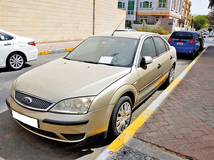 A dusty vehicle on an Abu Dhabi street