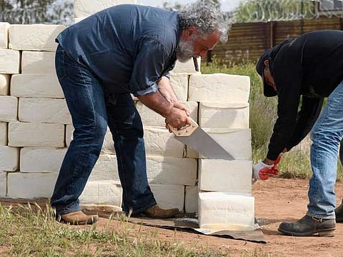 Montreal-born artist builds wall of rotting cheese on US-Mexico border.  Italian-Canadian Cosimo Cavallaro, an artist from New York, used blocks of cheese to "erect a wall" a few feet from the US-Mexico border in Texate, California. 