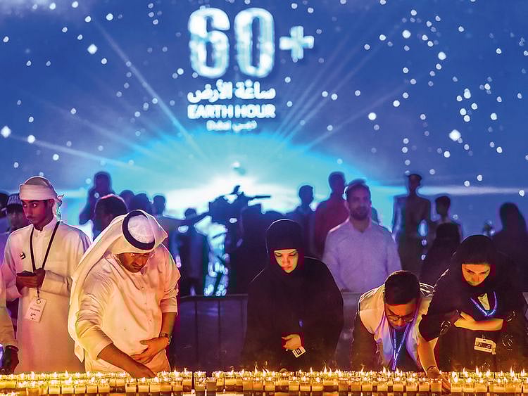 Residents light candles
