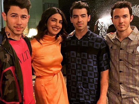 Nick Jonas, Priyanka Chopra, Joe and Kevin Jonas.