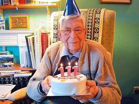 England's oldest man Bob Weighton with a birthday cake when he turned 111.